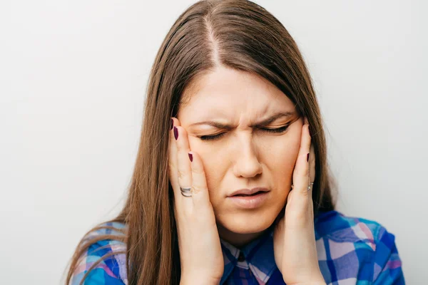 Young woman with a headache — Stock Photo, Image