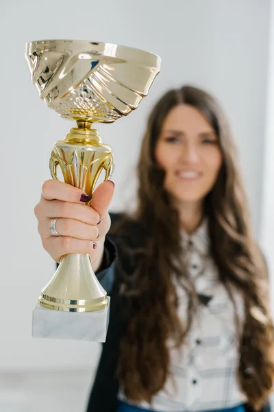 Girl holding a prize cup — Stock Photo, Image