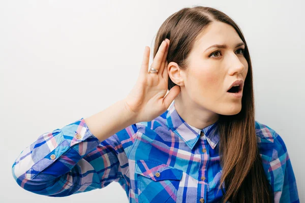 Young woman overhears — Stock Photo, Image