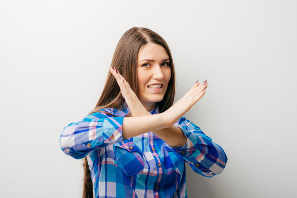 girl shows timeout gesture