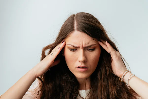 Girl has pain in temples — Stock Photo, Image