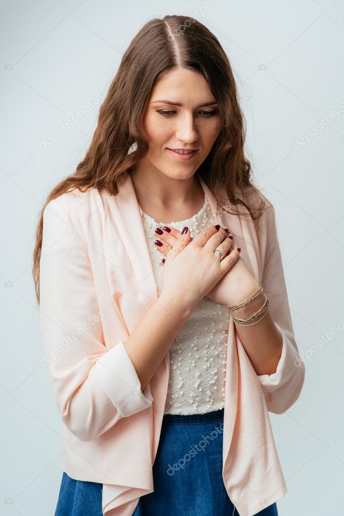 Girl puts her hands on chest Stock Photo by ©file404 113970740