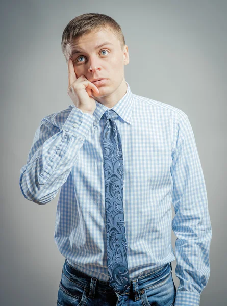 Young guy thinks — Stock Photo, Image