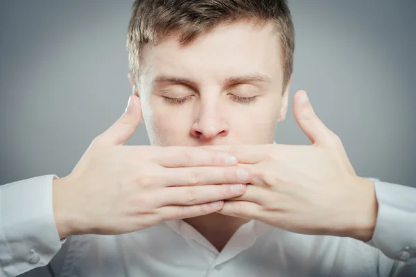 Man keep his mouth closed by hands — Stock Photo, Image