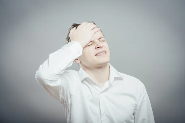 Man with hand on his head — Stock Photo, Image