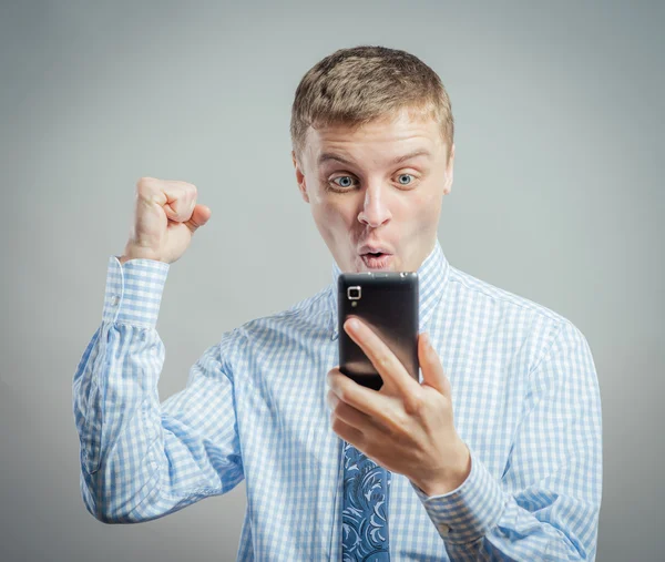 Exited man with mobile phone — Stock Photo, Image