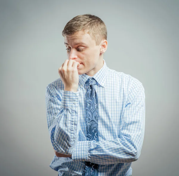 Man biting his nails — Stock Photo, Image