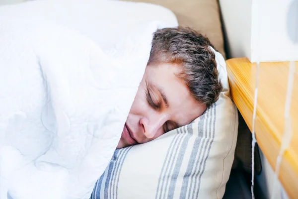 Man sleeping in his bedroom — Stock Photo, Image