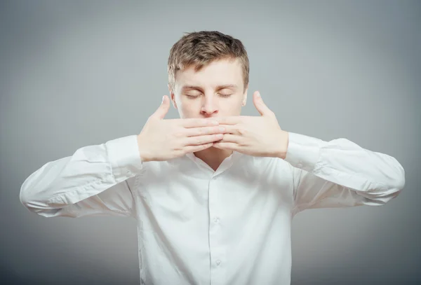 Man keep his mouth closed by hands — Stock Photo, Image