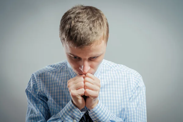 Young businessman praying — Stock Photo, Image