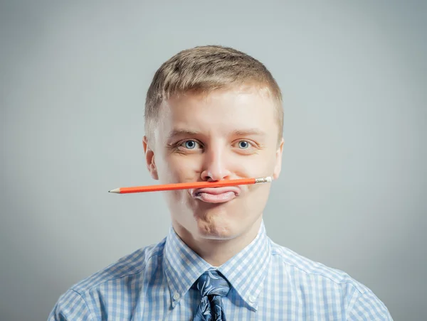 depositphotos_114077198-stock-photo-man-holding-a-pencil-between.jpg