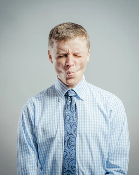 Man sucking in his cheeks — Stock Photo, Image