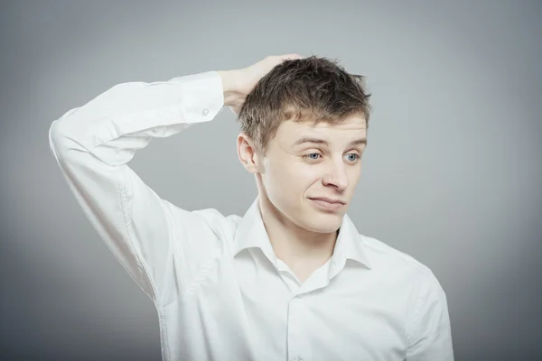 Confused young man — Stock Photo, Image