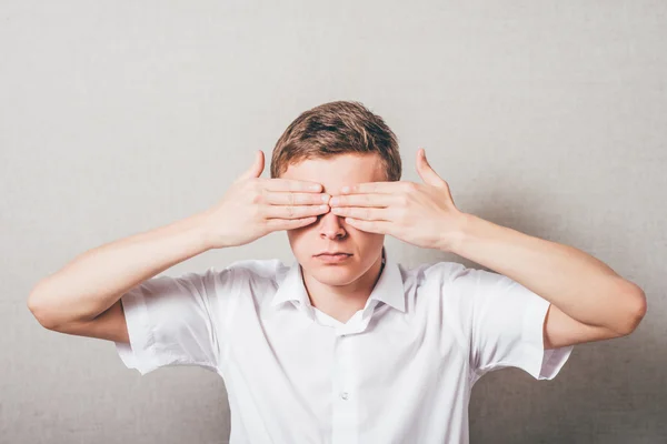 Man closed his eyes with his hands — Stock Photo, Image