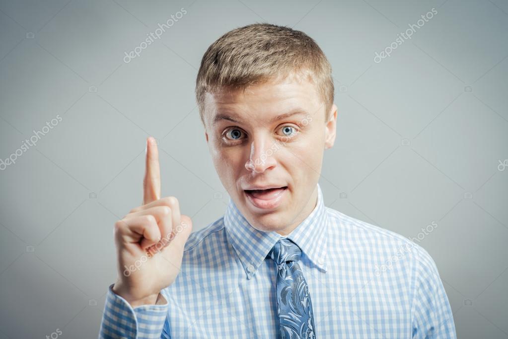 Man raising his finger in the air Stock Photo by ©file404 114078398