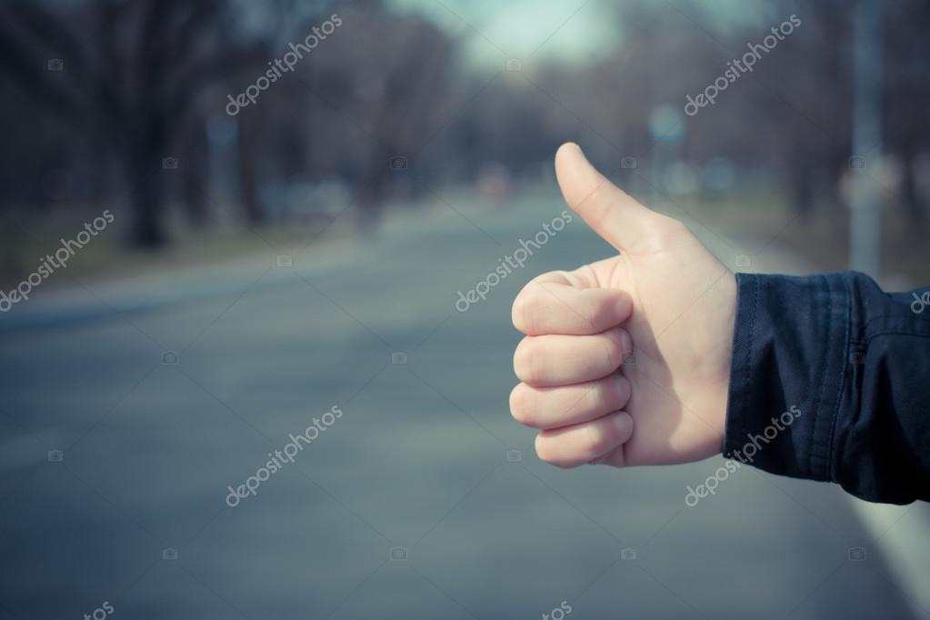 Hitchhiker sign thumb up Stock Photo by ©file404 114079644