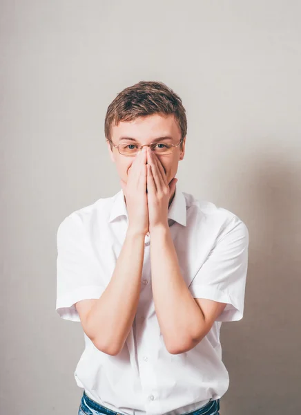 Man covering his mouth with hands — Stock Photo, Image