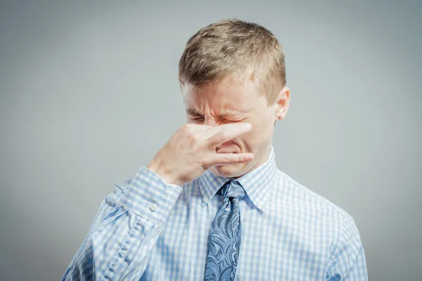 Man pinches his nose — Stock Photo, Image
