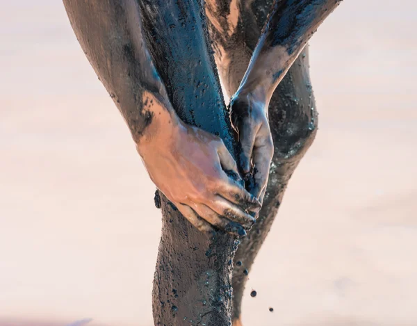 man making mud treatment