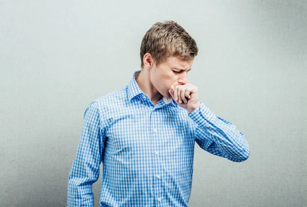 Young man coughs — Stock Photo, Image