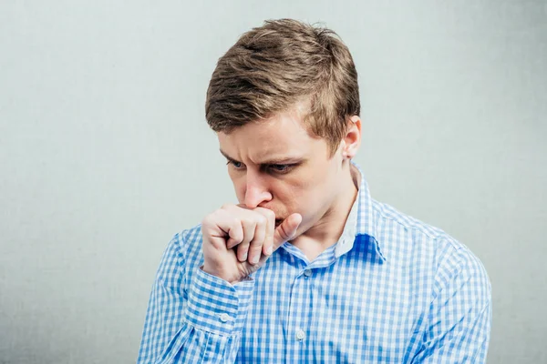 Young man coughs — Stock Photo, Image