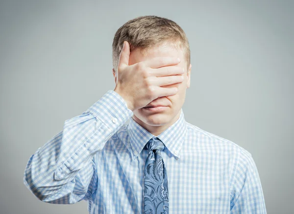 Man closes his eyes with his hand — Stock Photo, Image