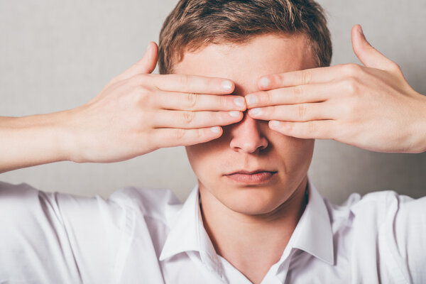  man closed his eyes with his hands