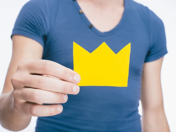 Paper crown in hand — Stock Photo, Image