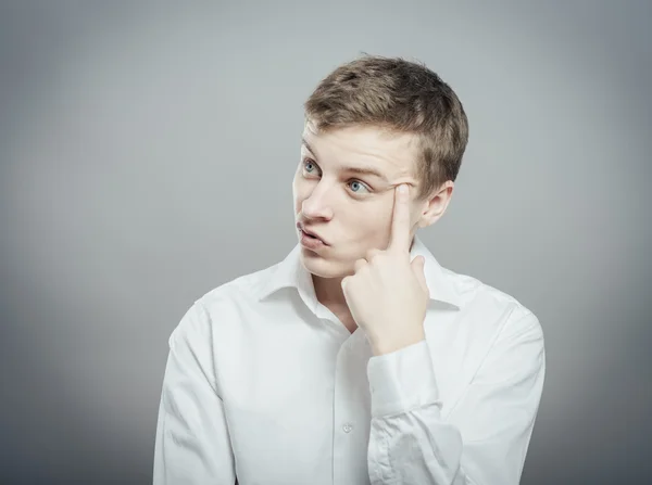 Young guy thinks — Stock Photo, Image