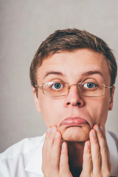 Man holding hands on his cheeks — Stock Photo, Image