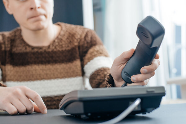 man using telephone in the office