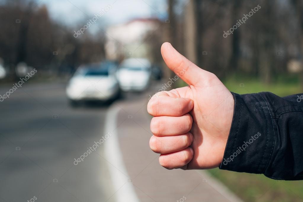 Hitchhiker sign thumb up Stock Photo by ©file404 114082002