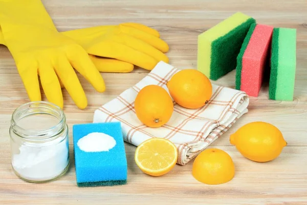 Eco friendly natural cleaners. Home cleaning concept. Baking soda (sodium bicarbonate), lemon, salt and kitchen utensils.