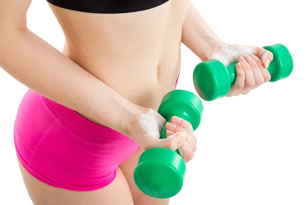 Fitness girl with green dumbbells — Stock Photo, Image