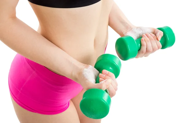 Menina fitness com halteres verdes Fotografia De Stock