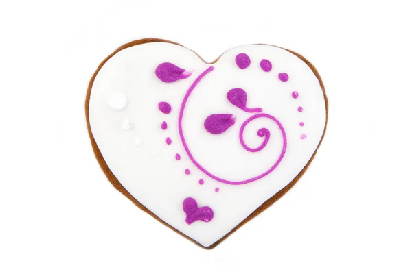 Biscoito de gengibre em forma de coração com cobertura branca e rosa Imagens De Bancos De Imagens