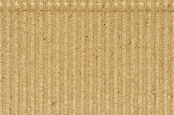Corrugated cardboard goffer paper texture, bright rough old recycled goffered textured blank empty grunge copy space background large aged grungy macro closeup vertical taupe brown tan yellow beige — Stock Photo, Image
