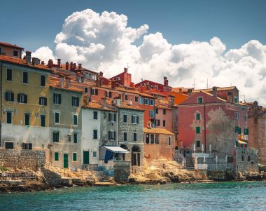 Rovinj, Croatia  June 5, 2024: Colorful historic waterfront houses along the Adriatic coast in Rovinjs old town, Istria region, under bright Mediterranean summer light