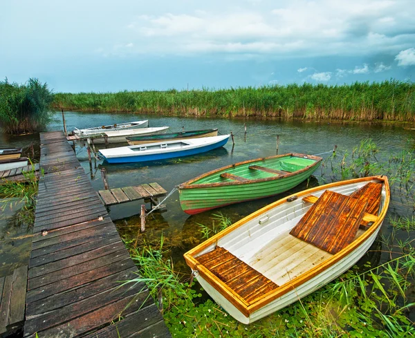 Wooden boats near pier — Stock Photo, Image