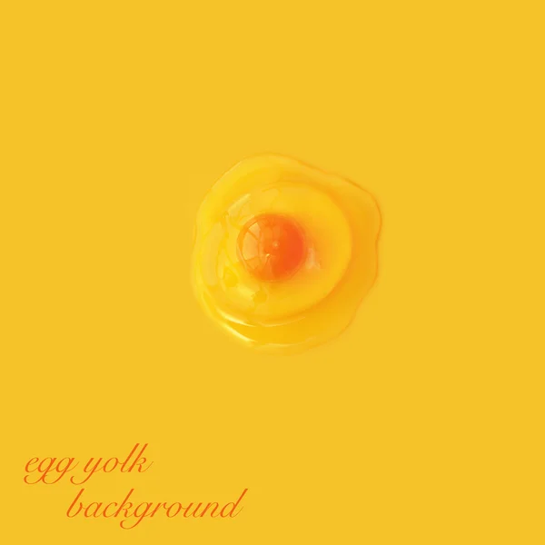 Яєчний жовток на жовтому фоні — стокове фото