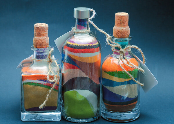 bottles with colorful sand