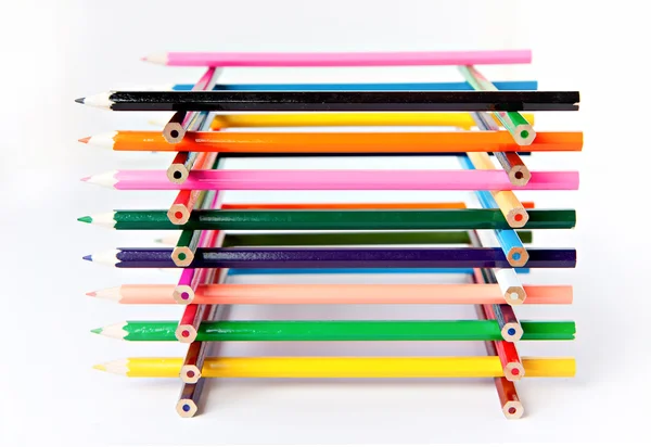 孤立在白色背景的彩色调色板木制蜡笔铅笔 免版税图库照片