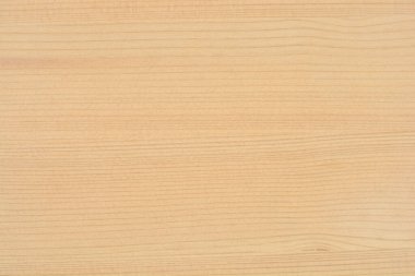 Yakın çekim, tam çerçeve görüntüsü pürüzsüz, soluk çam ağacının yüzeyini, ince, yatay tahıl çizgileri ve düğümsüz olarak yakalar.