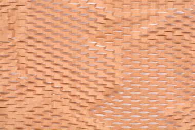 Yakın çekim kahverengi ambalaj kağıdının dokusunu gösterir. Yastık için genişletilebilir bal peteği deseni oluşturur.