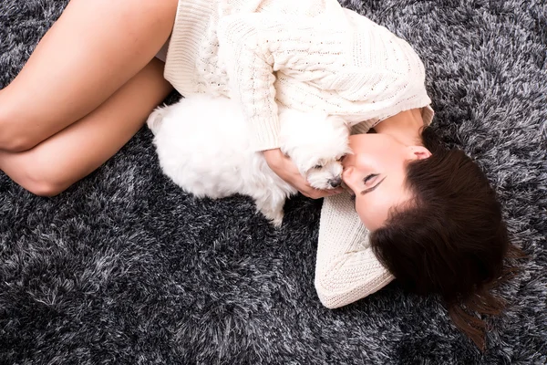 Young beautiful woman hugging her puppy — Stock Photo, Image