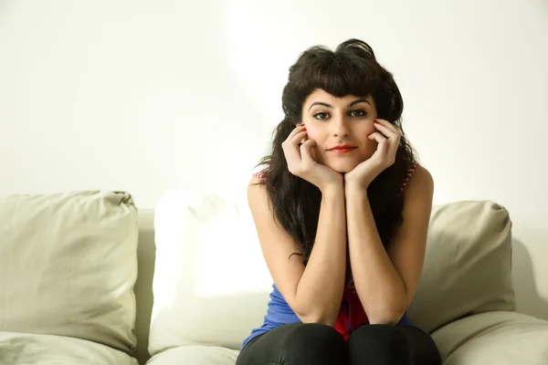 Retro Girl sitting in the sofa — Stock Photo, Image