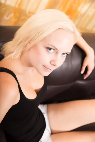 Girl relaxing on a Sofa — Stock Photo, Image