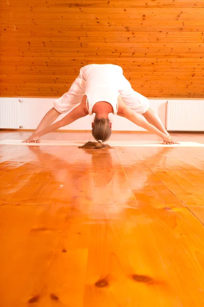 Woman practicing Yoga in a Studio Stock Picture