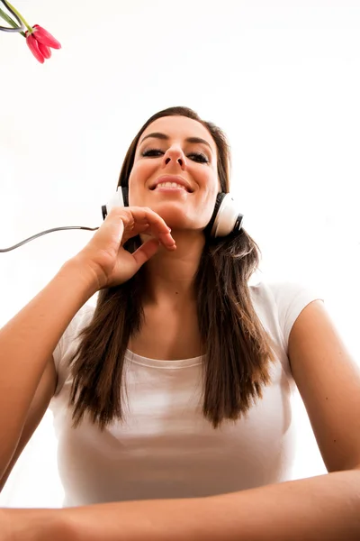 Young beautiful woman listening to audio — Stock Photo, Image