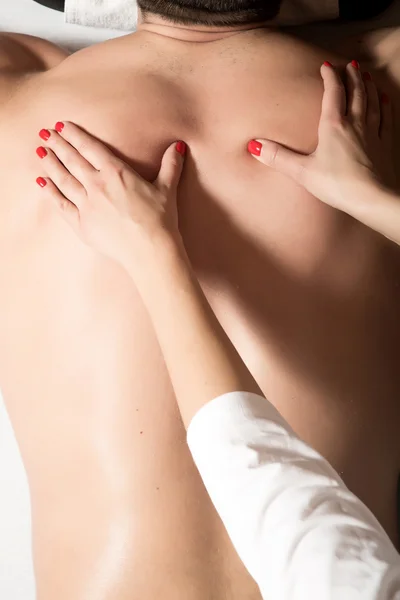 A young man receiving a massage — Stock Photo, Image